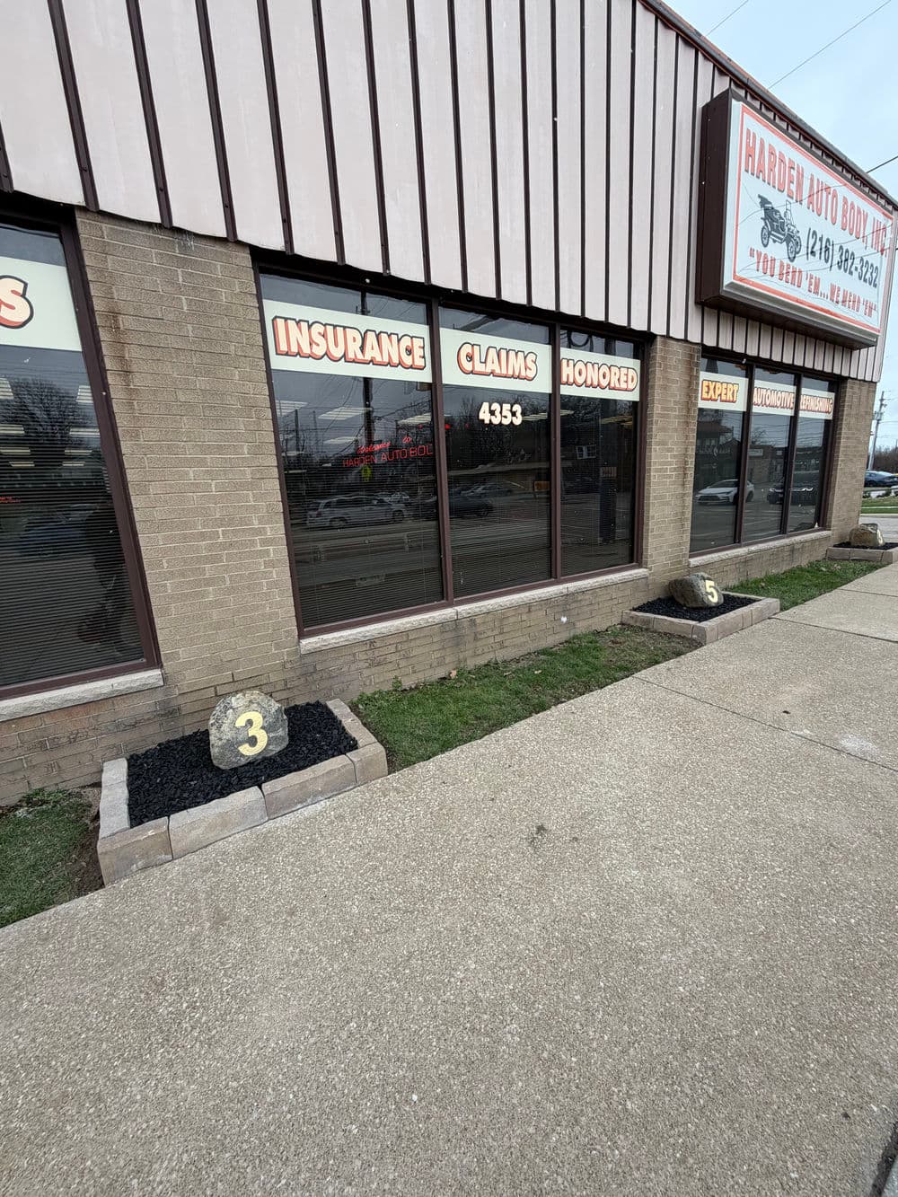 Harden Auto Body Shop storefront with insurance claims honored sign and address 4333.